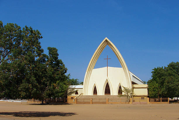 N'Djamena, Chad: Our Lady of Peace Catholic Cathedral N'Djamena, Chad: Notre Dame de la Paix Catholic Cathedral - between Félix Éboué and Charles de Gaulle Avenues - French Colonial architecture - the arch at Our Lady of Peace Cathedral is what remains of the original concrete roof, destroyed by war in 1980 chad central africa stock pictures, royalty-free photos & images