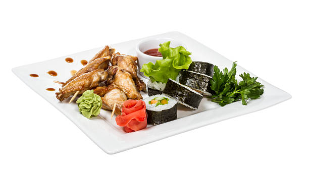 istock Buffalo chicken wings on plate with sushi 183200586
