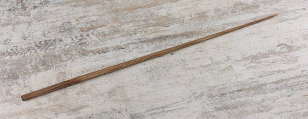 istock wooden school pointer on wooden background 1832007455
