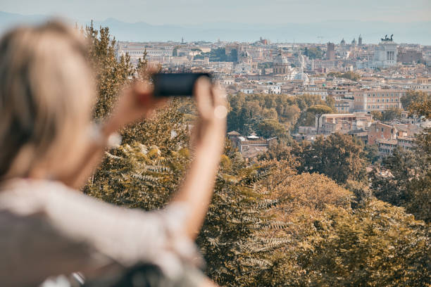 istock Young female tourist using phone while exploring big city 1832020914