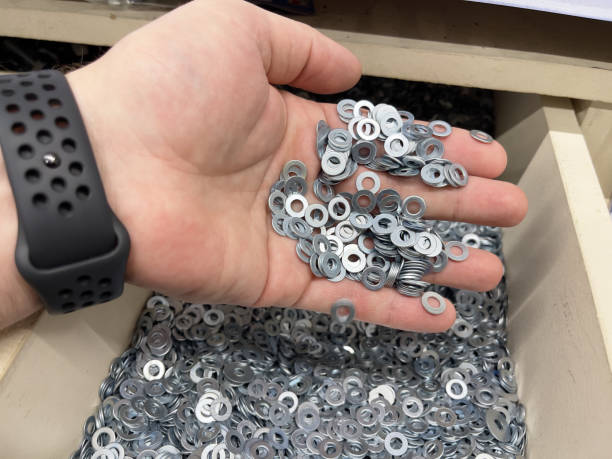 istock Metal washers in hand, close-up. 1832043430