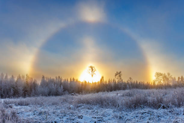 Cold winter day with a sun halo and sun dogs Cold winter day with a sun halo and sun dogs sundog stock pictures, royalty-free photos & images