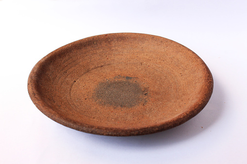 mortar earthenware traditional plate made of clay with isolated background