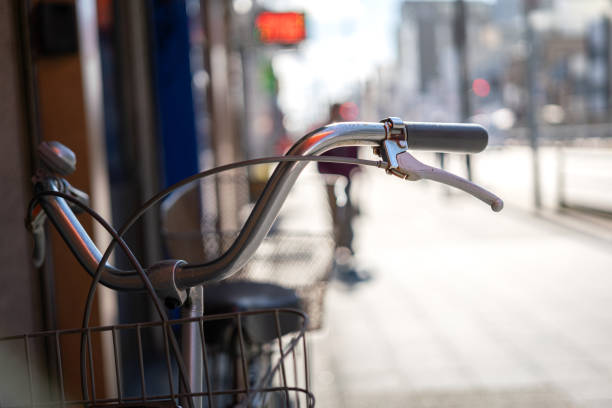 The classic style bike or bicycle vehicle, close-up at the handlebar part. Transportation vehicle object photo, selective focus.