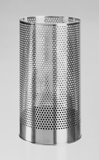 Reflective perforated metallic umbrella stand in light grey back