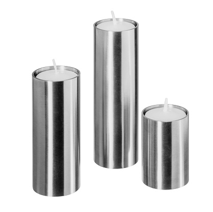 Four silver vintage LED real wax candles isolated on white background