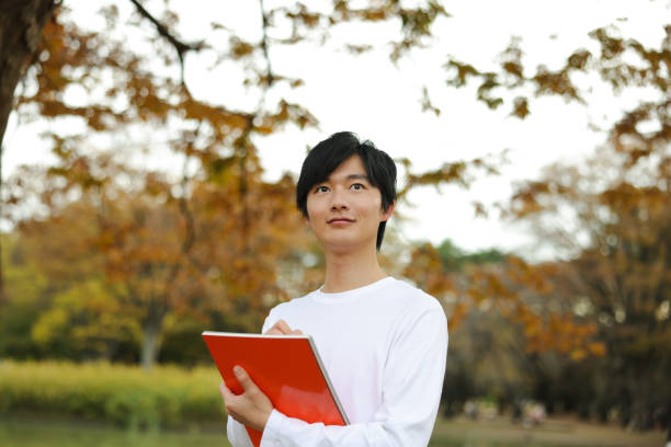 Asian individuals living their life to the fullest, by pursuing their hobbies, passions, and dreams.  Young man enjoying their hobbies with a positive, focused and joyful expressions
