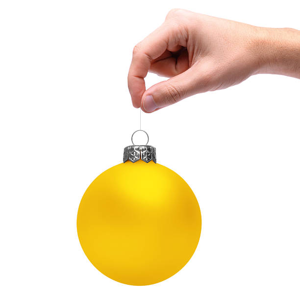 Hand Holding Christmas Bauble stock photo