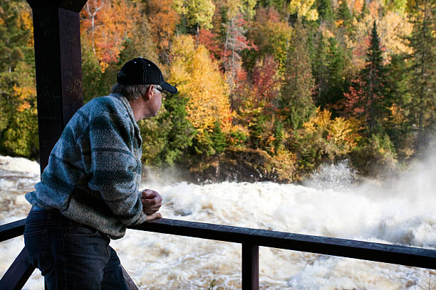 istock Senior Man looking at Waterfalls 183214707