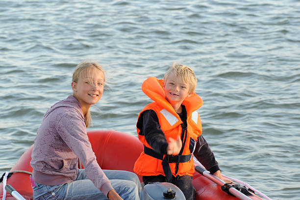 istock Sister and disabled brother in the dinghy 183214786