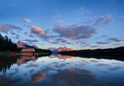 A sunset over Maligne Lake in Jasper National Park Canada. slight motion blur on the water.