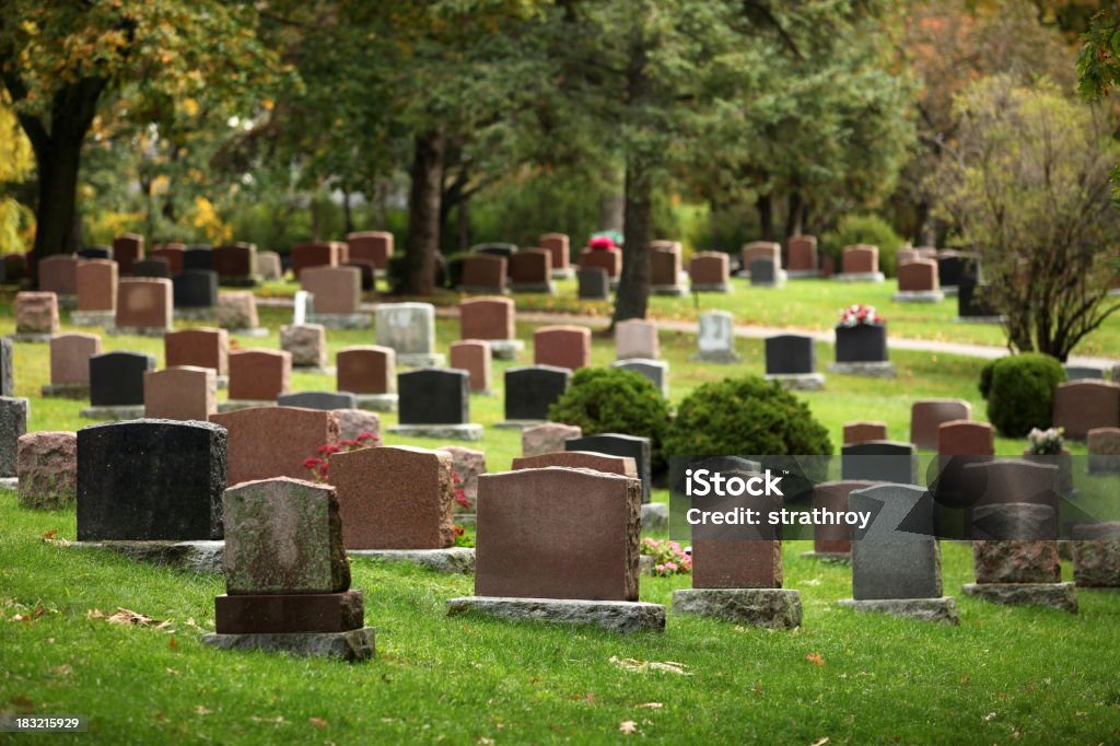 Autumnal Cemetery Tombstones in fall. Cemetery Stock Photo