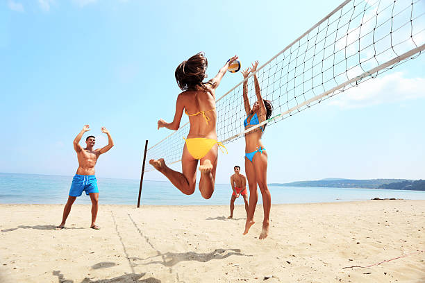 istock Activity on beach - group of friends playing volleyball 183216320