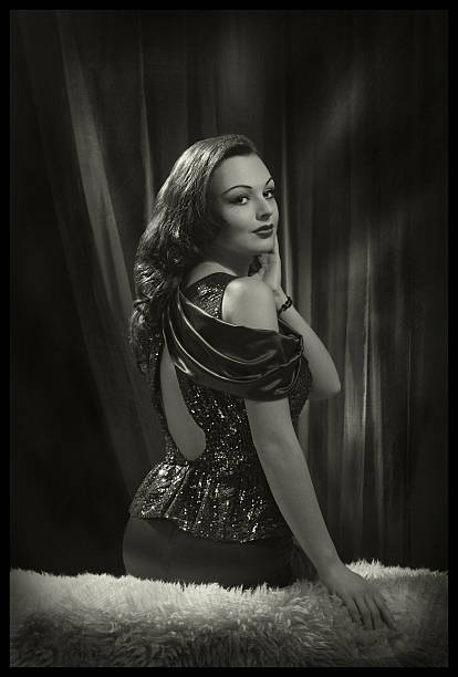 Glamour Beauty in Film Noir Style. Emulations of vintage style photography.See the Lightbox femme fatale stock pictures, royalty-free photos & images