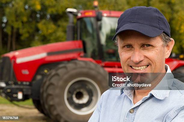 Farmer And His Red Tractor Stock Photo - Download Image Now - Adult, Adults Only, Agricultural Equipment