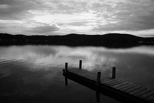 Jetty on lake in moody weather