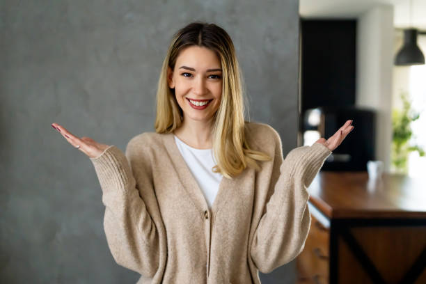 istock Smiling woman does not know which is the right decision. People decision choise concept. 1832178129
