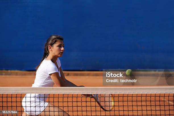 Female Tennis Player At Volley Stock Photo - Download Image Now - Tennis, Competition, Teenager