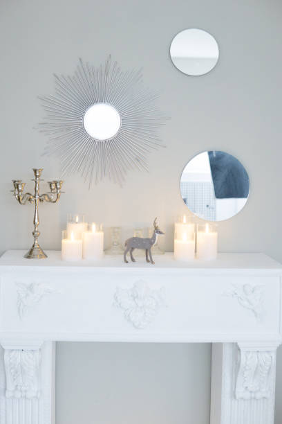 istock Bright interior with a false fireplace decorated for Christmas. 1832181851