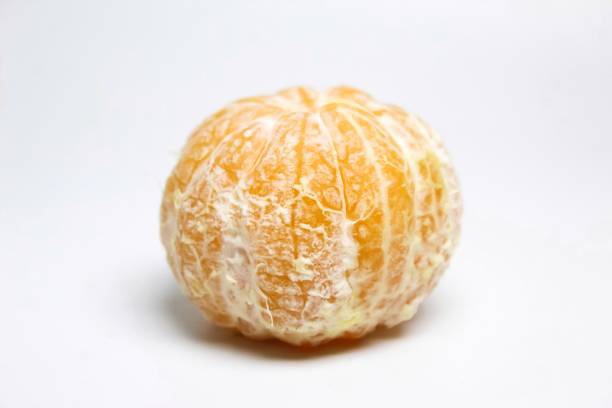 a peeled orange on a white background