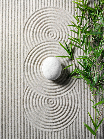 Three zen circles in a rock garden with bamboo in sand. Copy spaceClick the links below for more related images