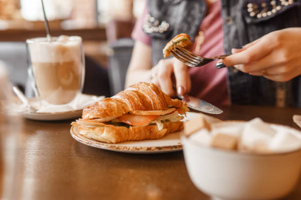 istock Croissant with egg on a plate, Breakfast in the cafe 1832194050