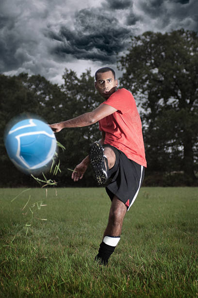 istock Football Player Kicking a Ball 183219592