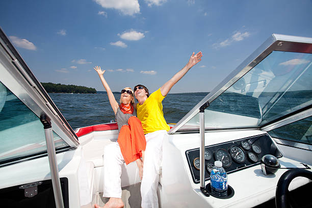 istock Young couple embracing in boat while relaxing on lake 183219862