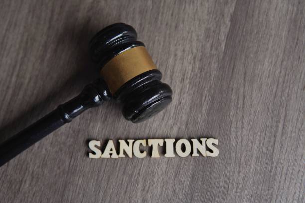 istock Close up image of judge gavel and text SANCTIONS. 1832201832