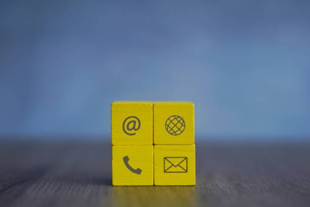 istock Closeup image of wooden cubes with communication icon. 1832201844