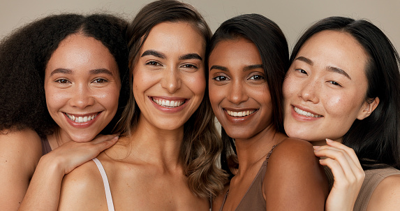 Natural beauty, skincare and diversity with women, dermatology and face isolated on studio background. Wellness, unique healthy skin and inclusion with cosmetic care, makeup shine and portrait