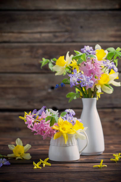 istock beautiful spring flowers on dark old wooden background 1832224852