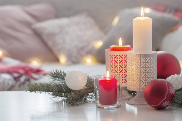 istock Christmas decora with candles and balls on white table indoor 1832224868