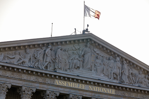 Paris, France - October 8, 2023 : view of the national French flag at the top of the National Assembly in Paris France