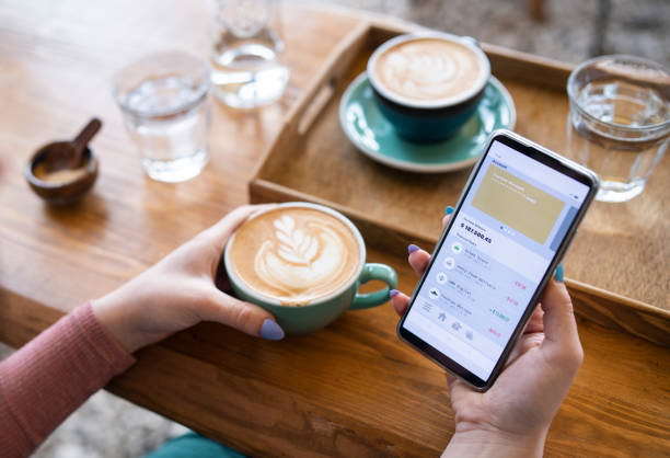 istock Managing online banking on cafe. 1832232937