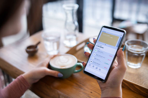 istock Woman managing online banking account on cafe. 1832233355