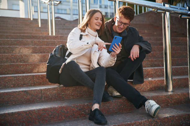 istock Having a break. Two young students are together outdoors 1832255291