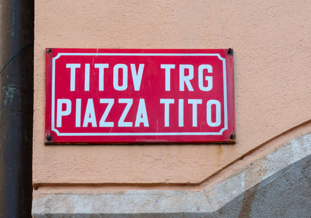 Koper, Slovenia - November 8, 2023: Bilingual slovenian and italian name of the Tito square in Koper, Slovenia, dedicated to the ex-yugoslav dictator.