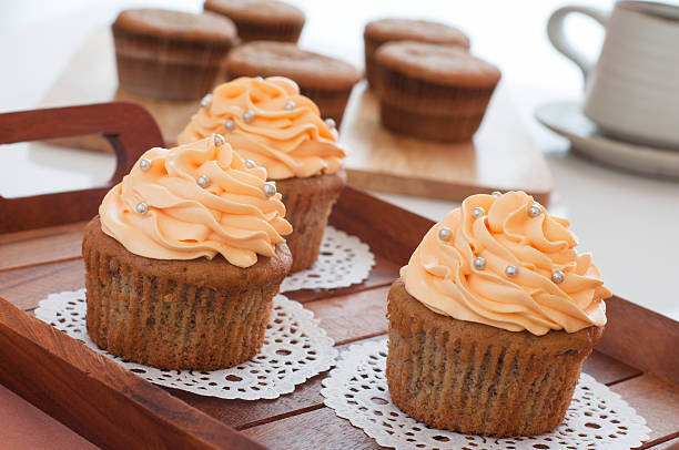 Homemade cupcakes served on kitchen table. stock photo