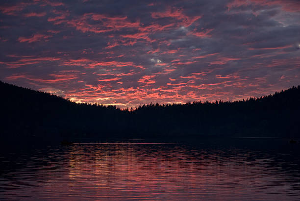 Sunset on Cascade Lake Sunsets in the San Juan Islands can be spectacular. This sunset was photographed from Cascade Lake. Cascade Lake is in Moran State Park on Orcas Island, Washington State, USA. jeff goulden san juan islands stock pictures, royalty-free photos & images