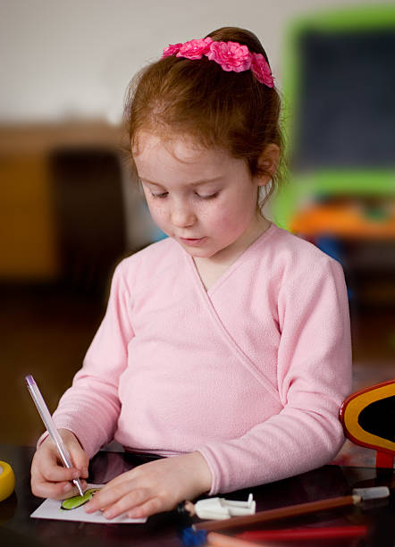istock Fully concentrated girl, drawing 183231841