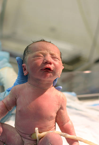 istock Baby just born with umbilical cord still attached  183232349