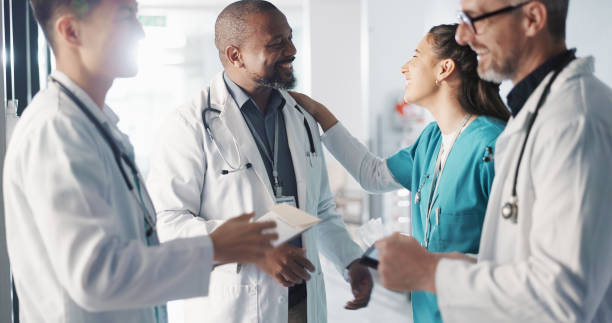 istock Doctors, nurses and team or hospital management with workflow, schedule planning and speaking of services. Healthcare worker, mentor and people with medical documents, clinic files and internship 1832324483