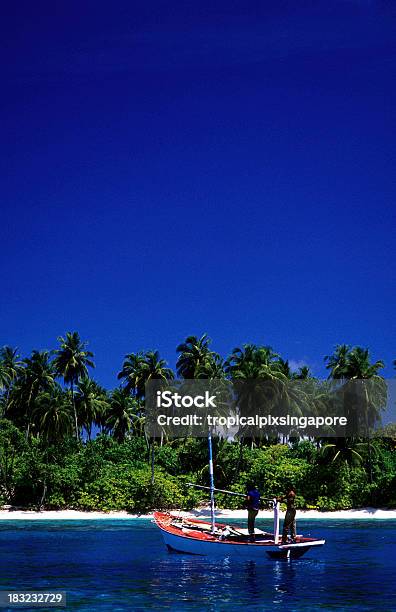 Maldives Southern Atolls Island And Traditional Dhoni Stock Photo - Download Image Now