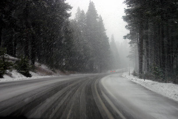 winter road home - snowing stock photo