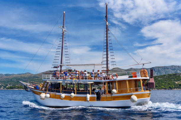 Rabac, Croatia – June 09, 2022: The Fish Picnic tourist ship sailing on the sea near Rabac, Croatia