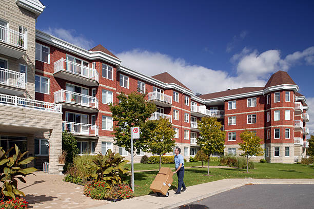 istock delivery man with hand truck 183233898