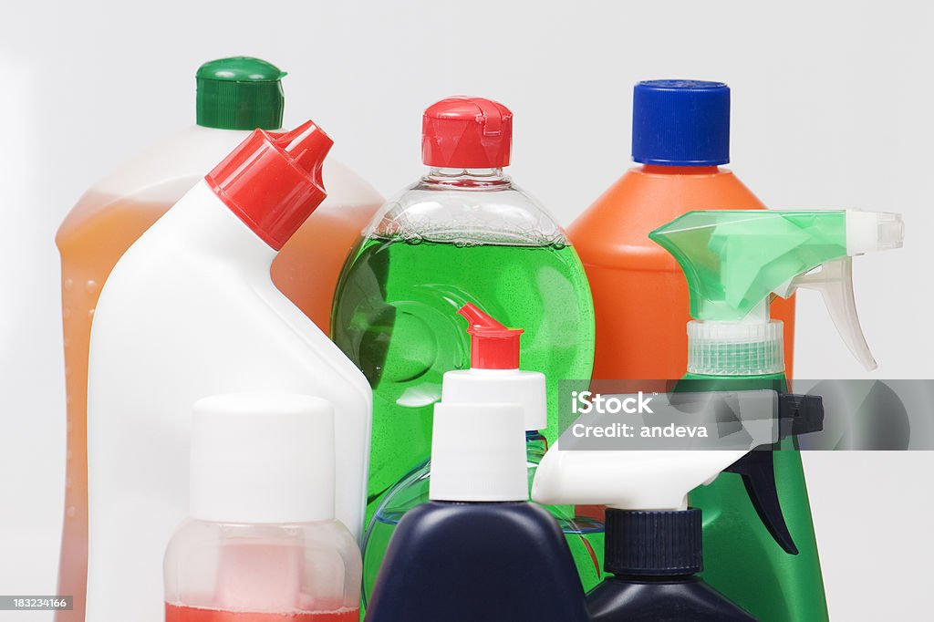 Assortment of liquid cleaning products in plastic bottles Group of cleaning products isolated on white Blue Stock Photo