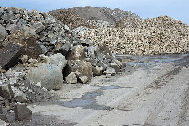 Construction Rubble Mounds of different of stone and gravel grades. quarry stock pictures, royalty-free photos & images
