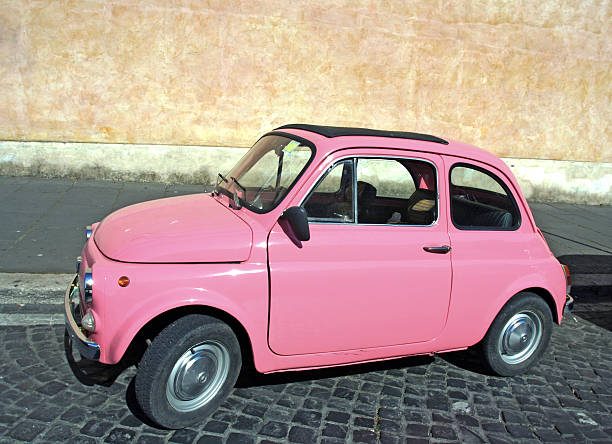 istock Tiny pink vintage car, Rome Italy 183234245